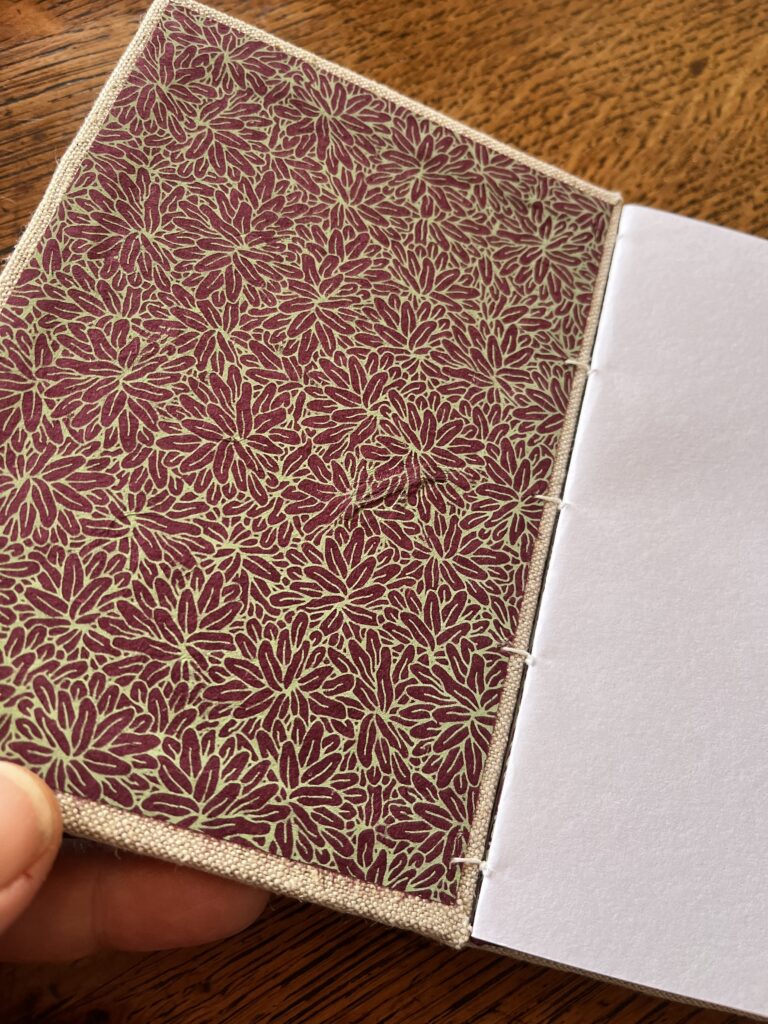 Carnet reliure copte aubergine et vert pistache